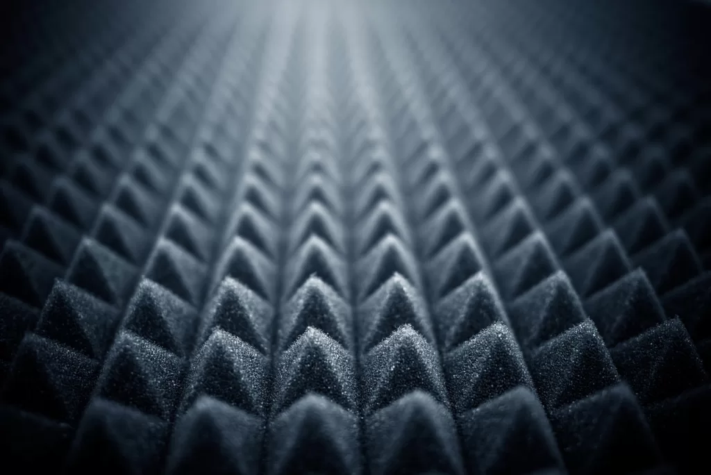 Acoustic foam is another option, and can be used to cover walls and ceilings to reduce echoes and reverberation.