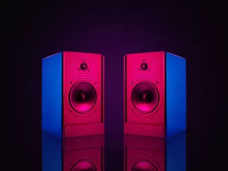Two stereo wired speakers with neon light on