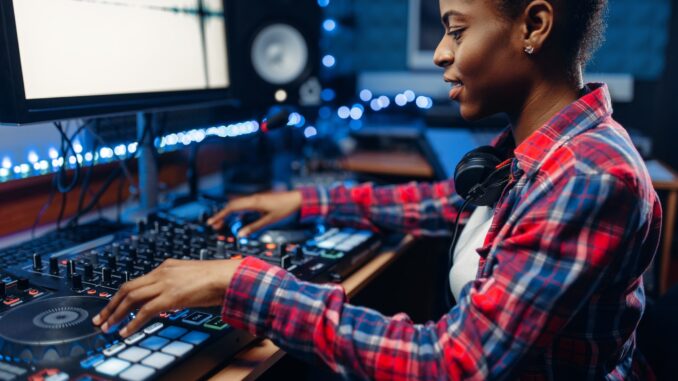 Female sound engineer in the recording studio