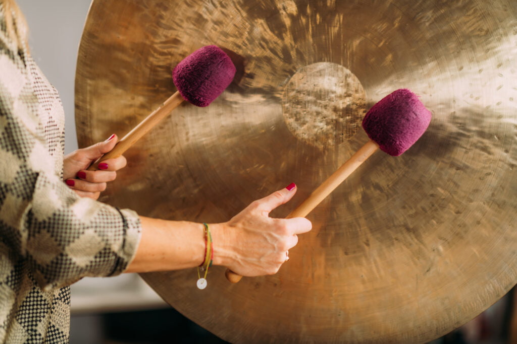 Sound Bath Therapy Playing Gong