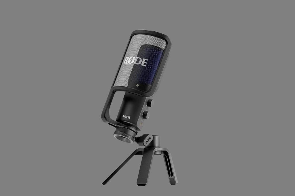 Rode NT-USB microphone mounted on a desktop stand, a top contender for the best microphone for YouTube podcasting and voice-overs.